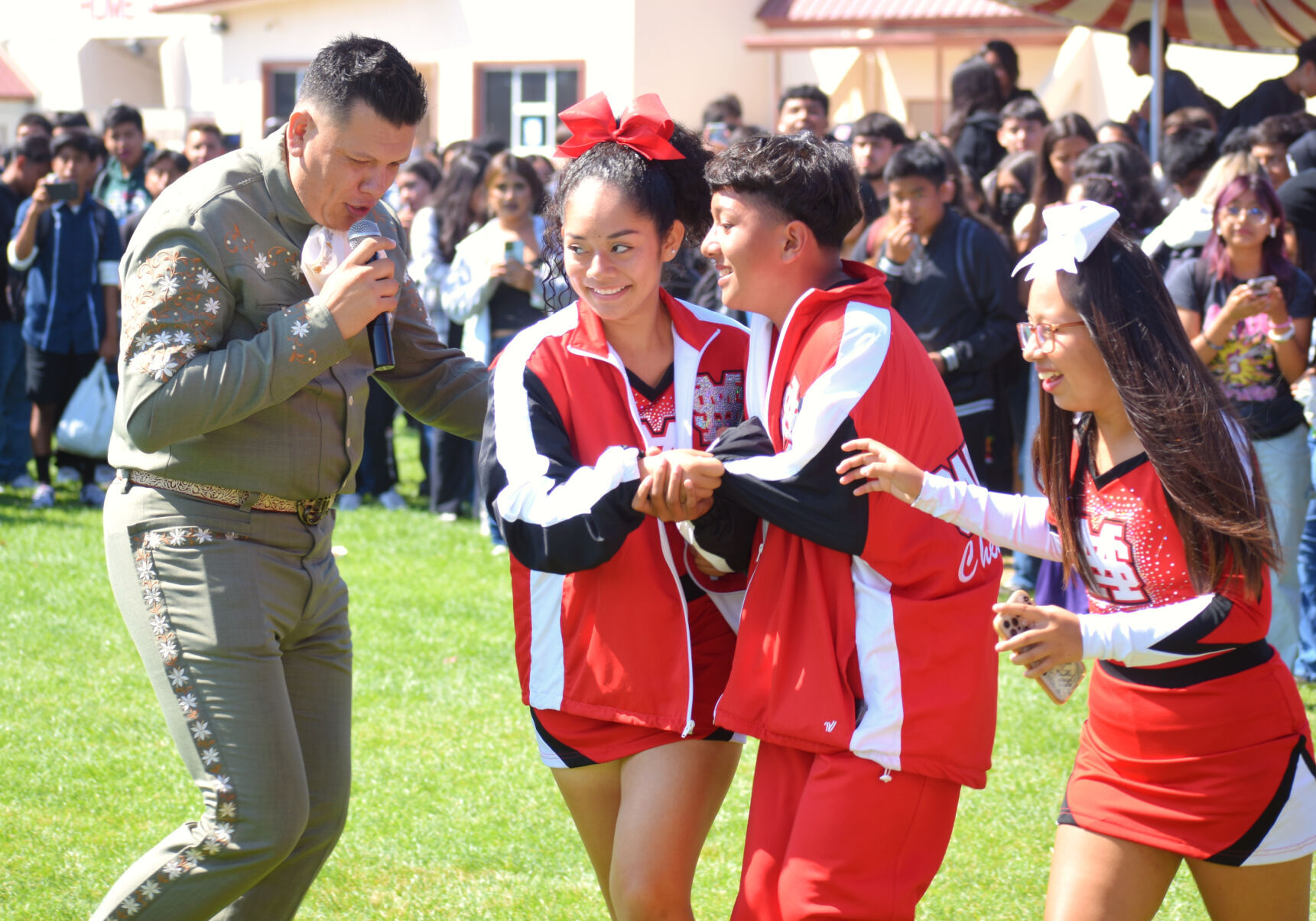 Santa Maria High School cheerleaders join in the festivities at the fall fair lunch time event Friday.